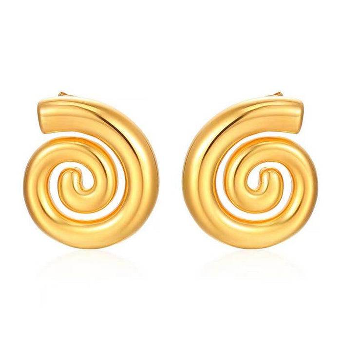 Pair of gold spiral earrings on a white background