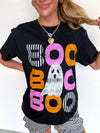 Person wearing a black t-shirt with colorful 'BOO' text and ghost graphic.