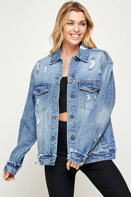 Woman wearing a blue denim jacket on a white background