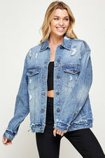 Woman wearing a blue denim jacket on a white background