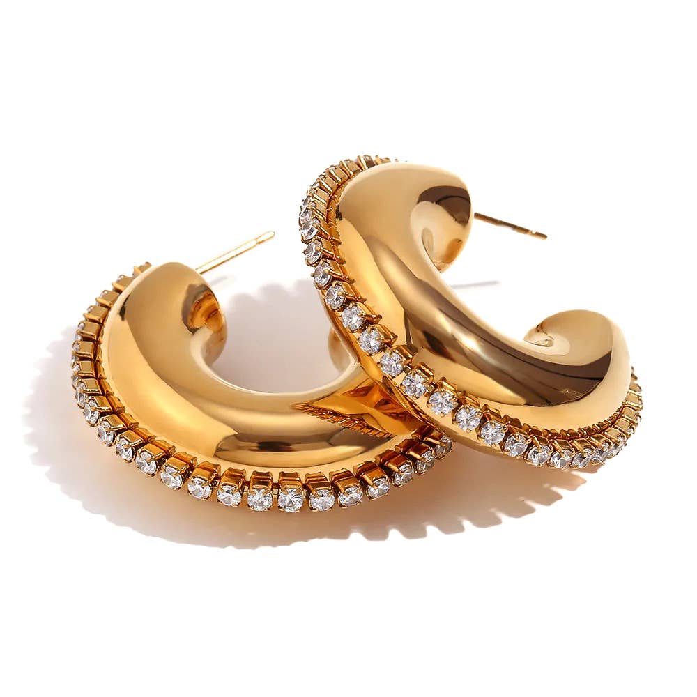 Gold hoop earrings with embedded diamonds on a white background