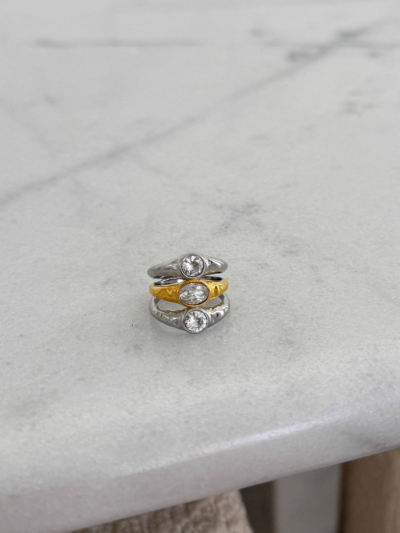 Stack of three rings on a marble surface
