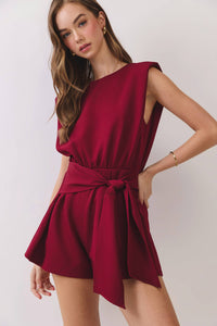 Woman wearing a red dress with a white background