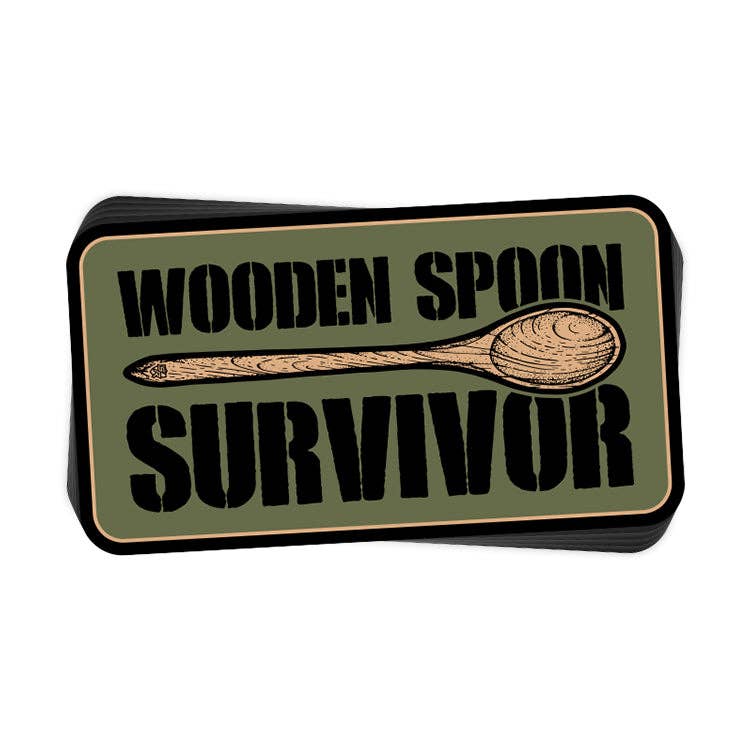 Rectangular sign with 'Wooden Spoon Survivor' text and a wooden spoon illustration on a green background.