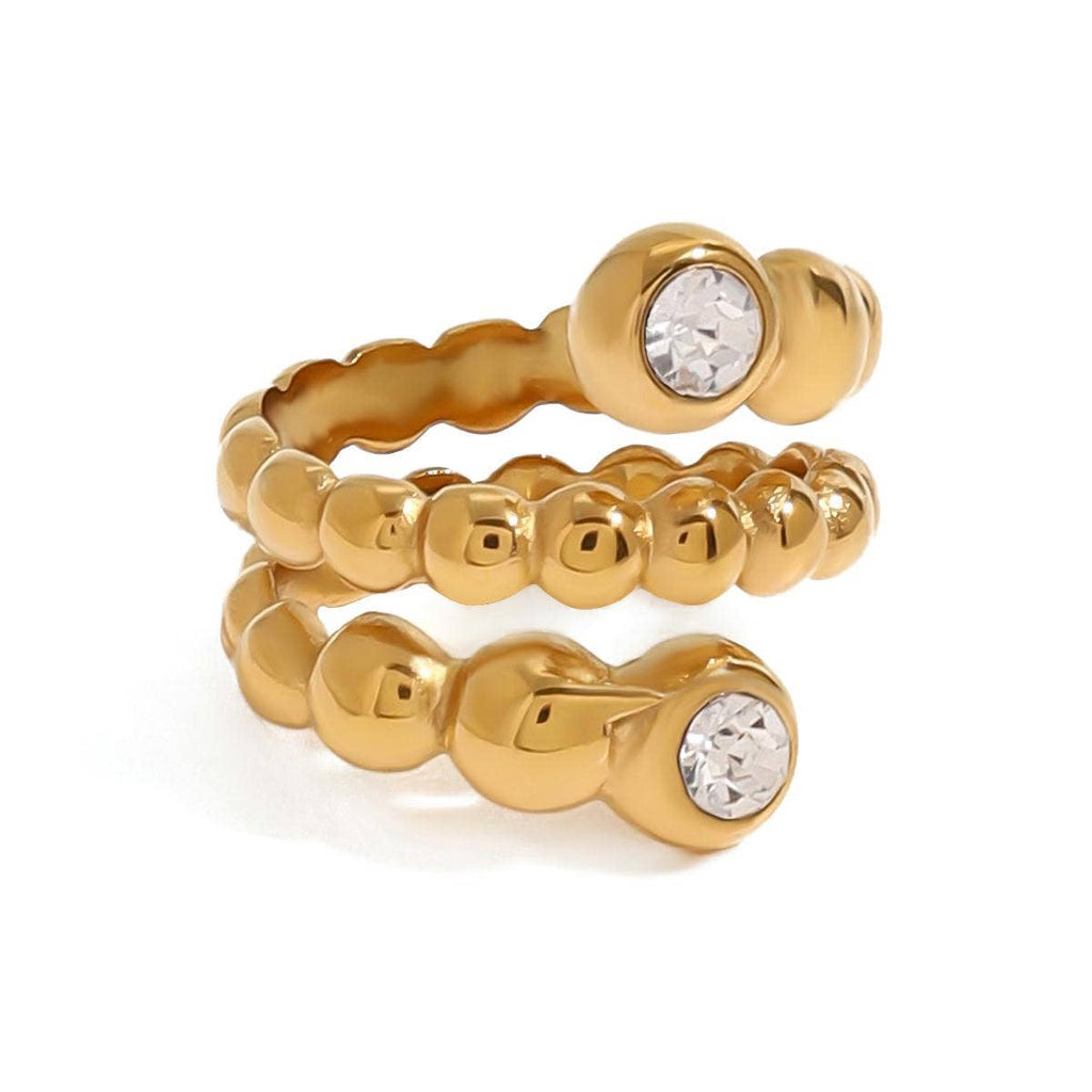 Gold ring with crystal stones on a white background