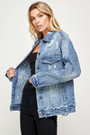 Woman wearing a blue denim jacket on a white background