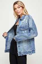 Woman wearing a blue denim jacket on a white background