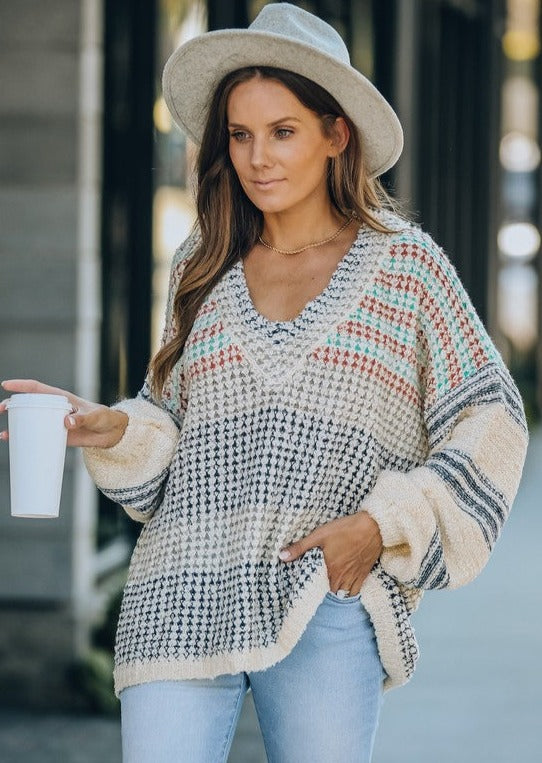 Fluffy is an understatement with this gorgeous piece! This oversized cozy sweater features and v-neckline and dolman sleeve. Runs on the larger side.
